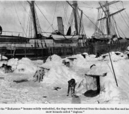 "The Endurance solidly embedded in ice with small houses for the dogs in the foreground." Argonauts of the South, 1925, From The Library at The Mariners’ Museum, G850.1911.H9.