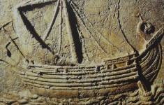 Phoenician ship carved on the face of a sarcophagus.